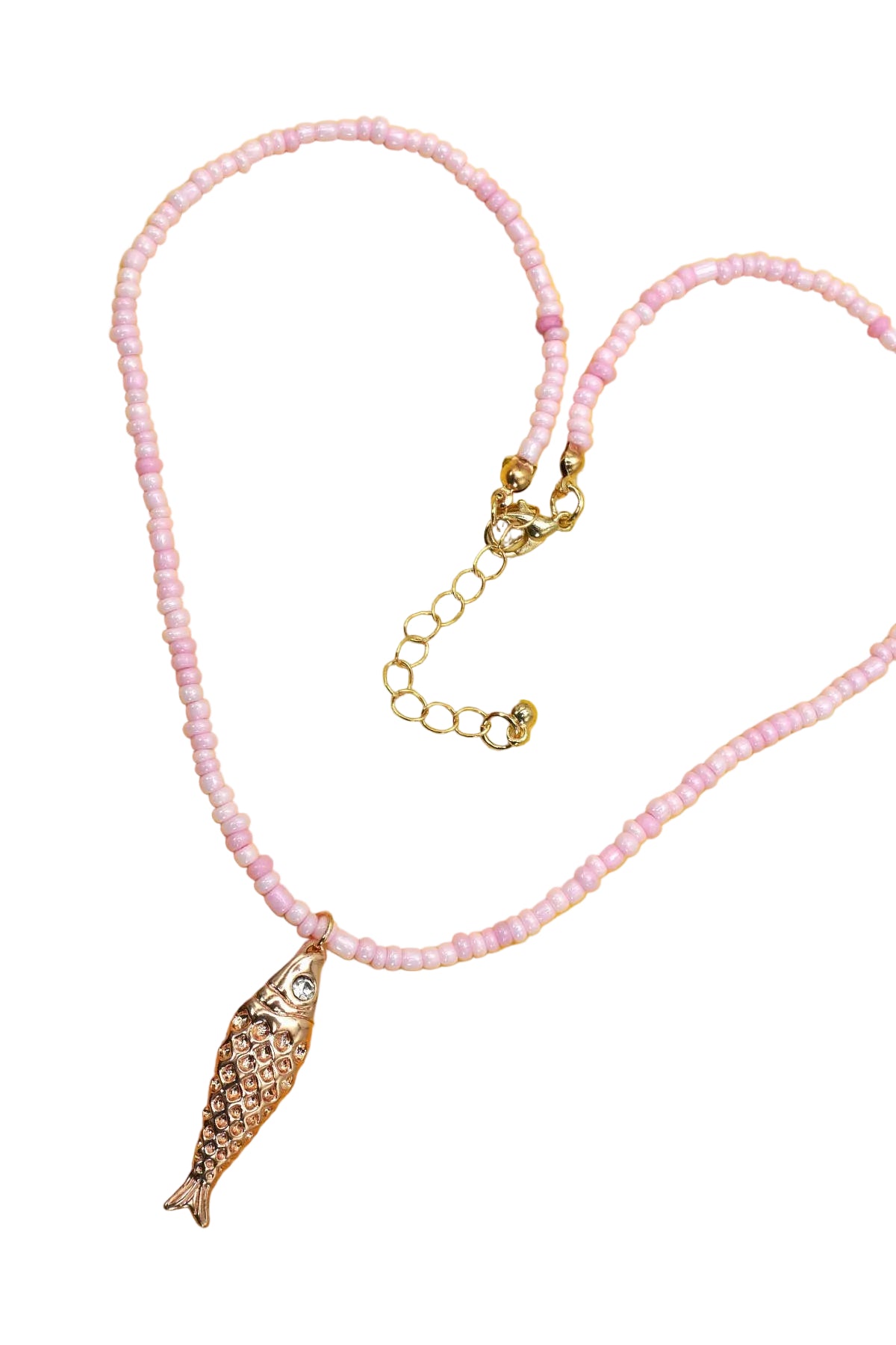 Pink seed bead necklace with an adjustable gold-tone chain and a crystal-embellished fish charm pendant for a fun coastal-inspired style.