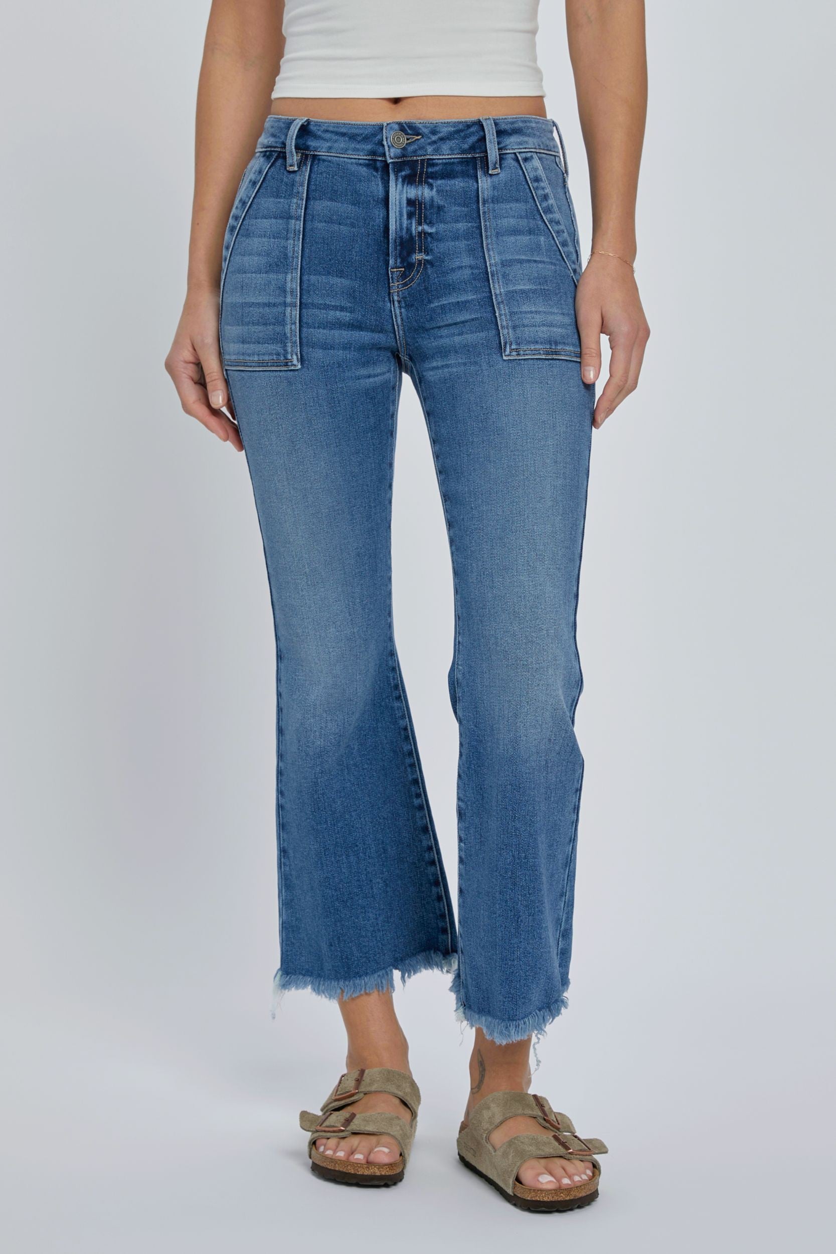 Hidden Inseam Happi Cargo Flare Medium Dark. These trendy flare jeans feature cargo front pockets and a frayed bottom hem in a comfortable stretch denim fabric that's perfect for everyday.