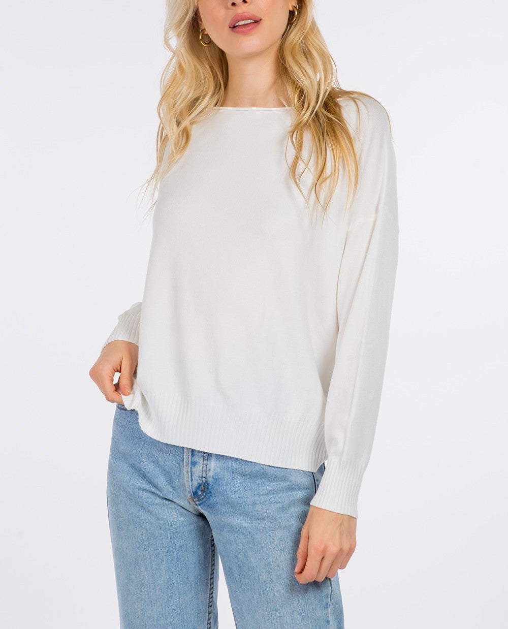 Madeline Boatneck Pullover Off White. This boatneck pullover sweater features ribbing at the hem and cuffs and a fitted design perfect for throwing on with your favorite jeans for a cute easy look.