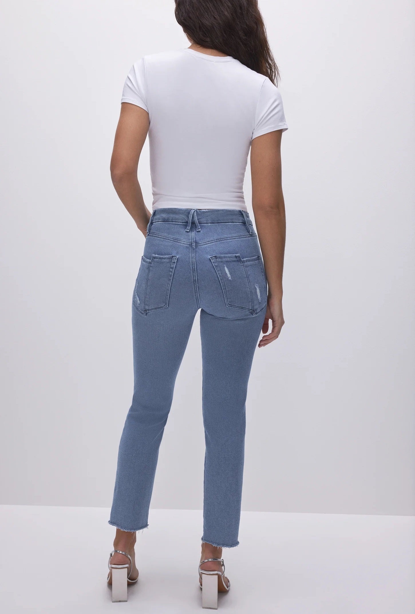 Good American Split Pocket Straight Jeans Blue. A high-rise vintage-inspired straight fit in smoothing denim, this will be your new favorite fit featuring a slimming fit and split back pocket detail.