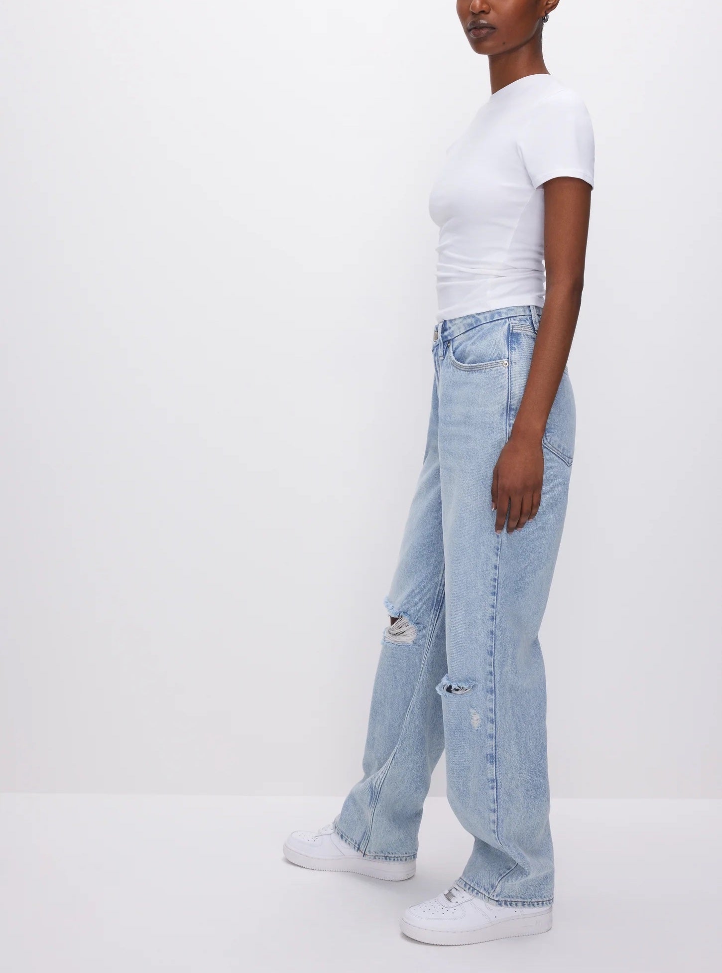 Good American 90s Jeans Blue. These iconic ‘90s inspired relaxed jeans feature a loose straight leg design, distressed knees and a rigid denim for the perfect vintage look.