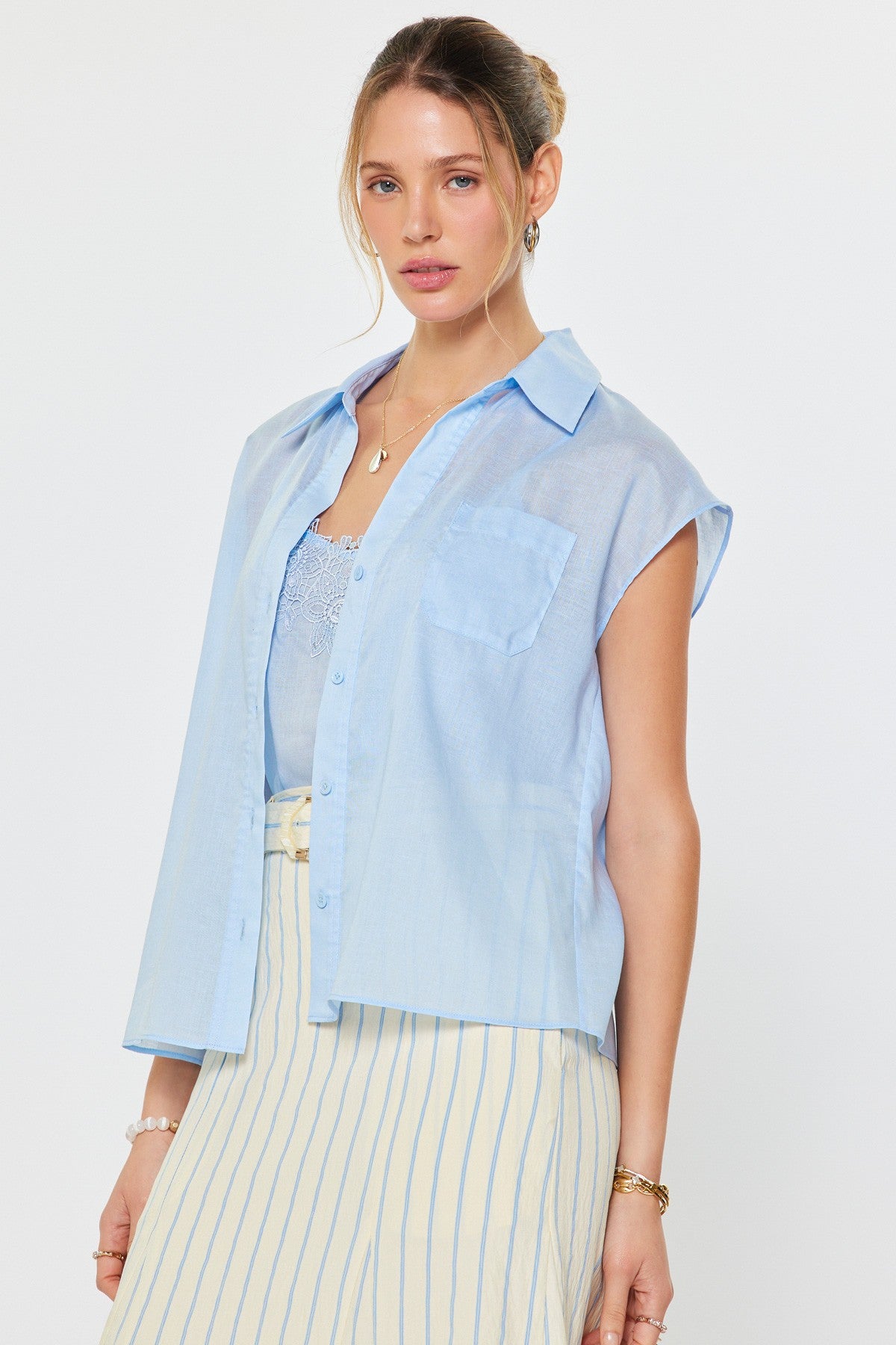 Two-piece set with a short sleeve button front top and matching striped pants styled together for a relaxed look