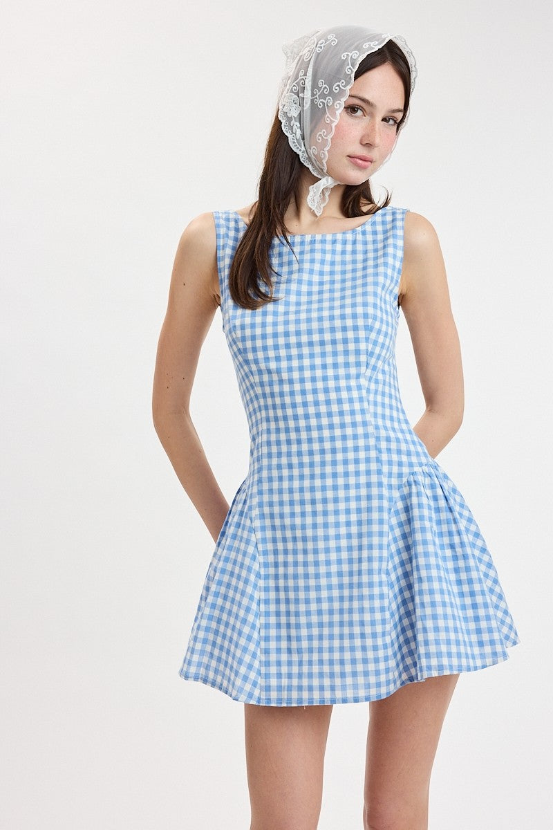 Gingham mini dress with fitted bodice and flared skirt styled with a headscarf