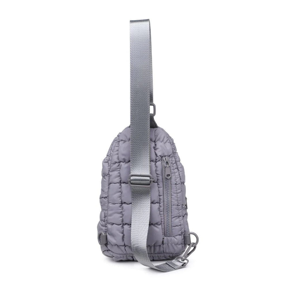 Sol and Selene Rejuvenate Sling Backpack Grey. The fashion-forward companion that fits right into your athleisure aesthetic. This nifty nylon number, showcasing a quilted design, packs style, and functionality into one neat, zippered package. So, you carry the essentials hands-free while looking effortlessly cool.