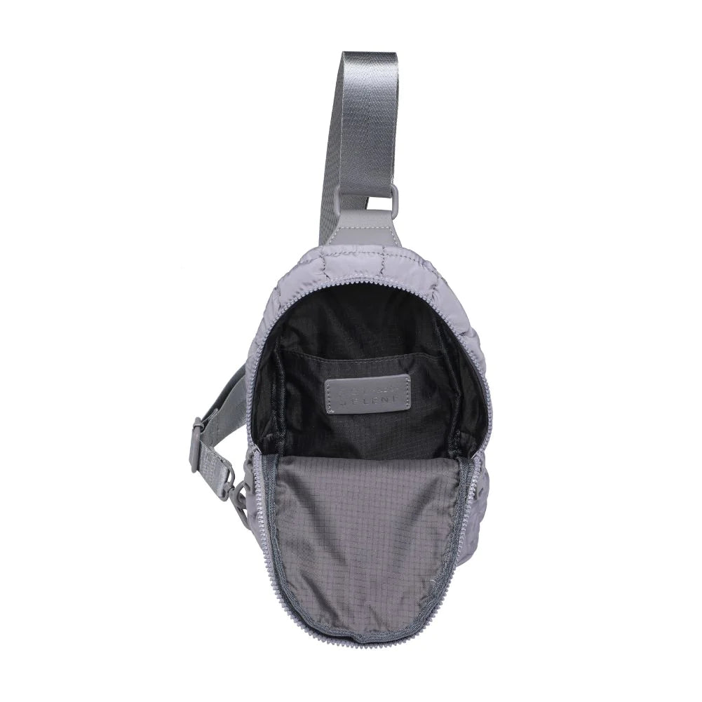 Sol and Selene Rejuvenate Sling Backpack Grey. The fashion-forward companion that fits right into your athleisure aesthetic. This nifty nylon number, showcasing a quilted design, packs style, and functionality into one neat, zippered package. So, you carry the essentials hands-free while looking effortlessly cool.