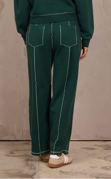 Woman wearing a wide-leg barbell pant with contrast stitching.