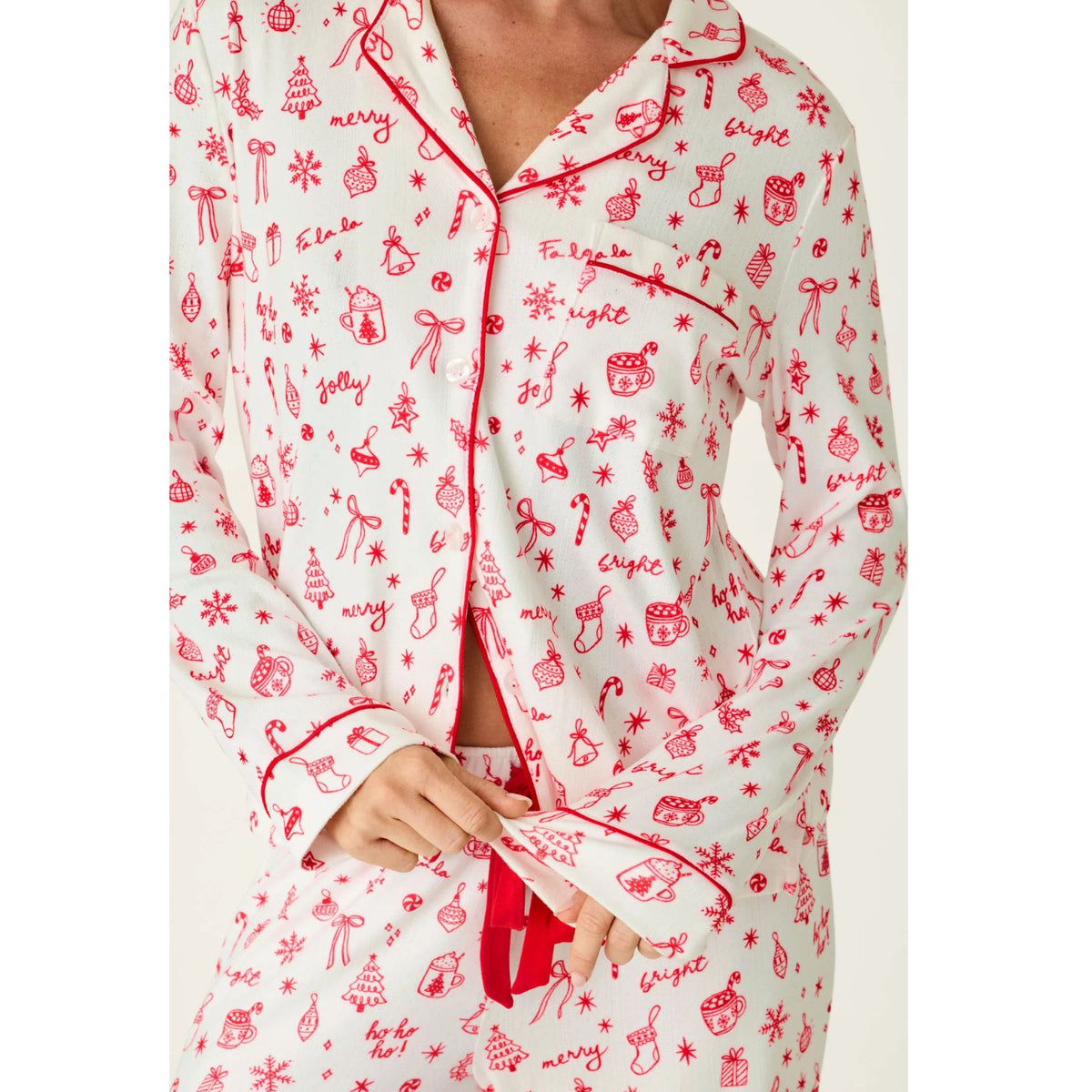Ivory three-piece holiday pajama set with red Christmas print, button-front top, pants, and matching eye mask