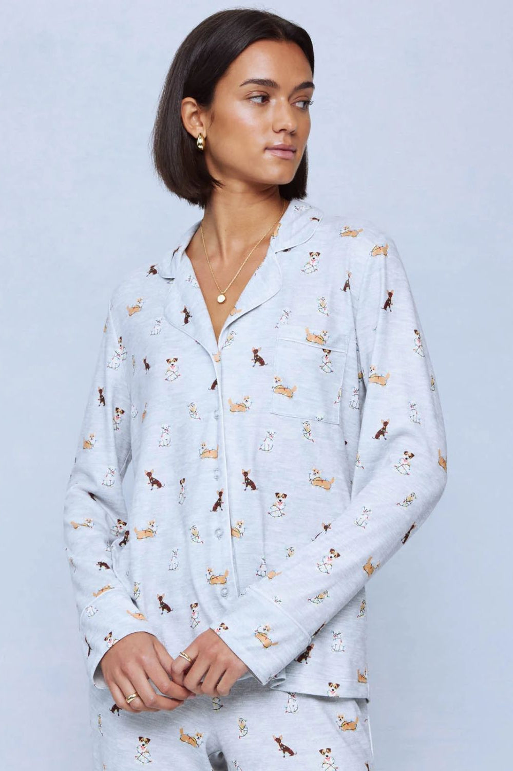 A cozy two-piece sleep set featuring brushed Pillowsoft fabric, a button-front top with contrast piping, and full-length drawstring pants for relaxing in comfort