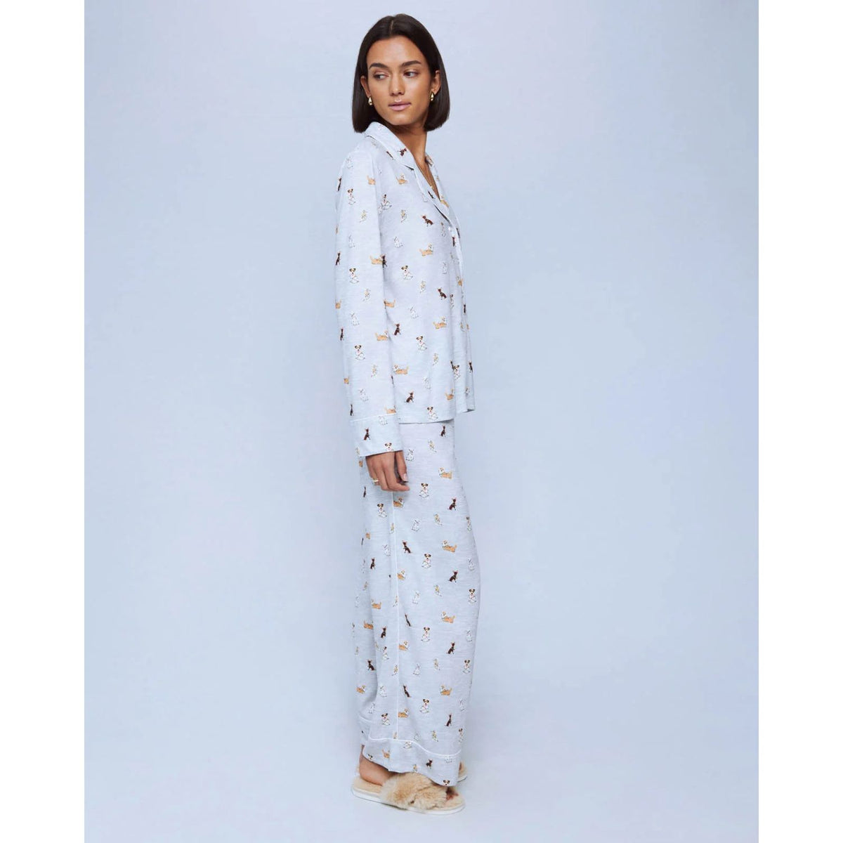 A cozy two-piece sleep set featuring brushed Pillowsoft fabric, a button-front top with contrast piping, and full-length drawstring pants for relaxing in comfort
