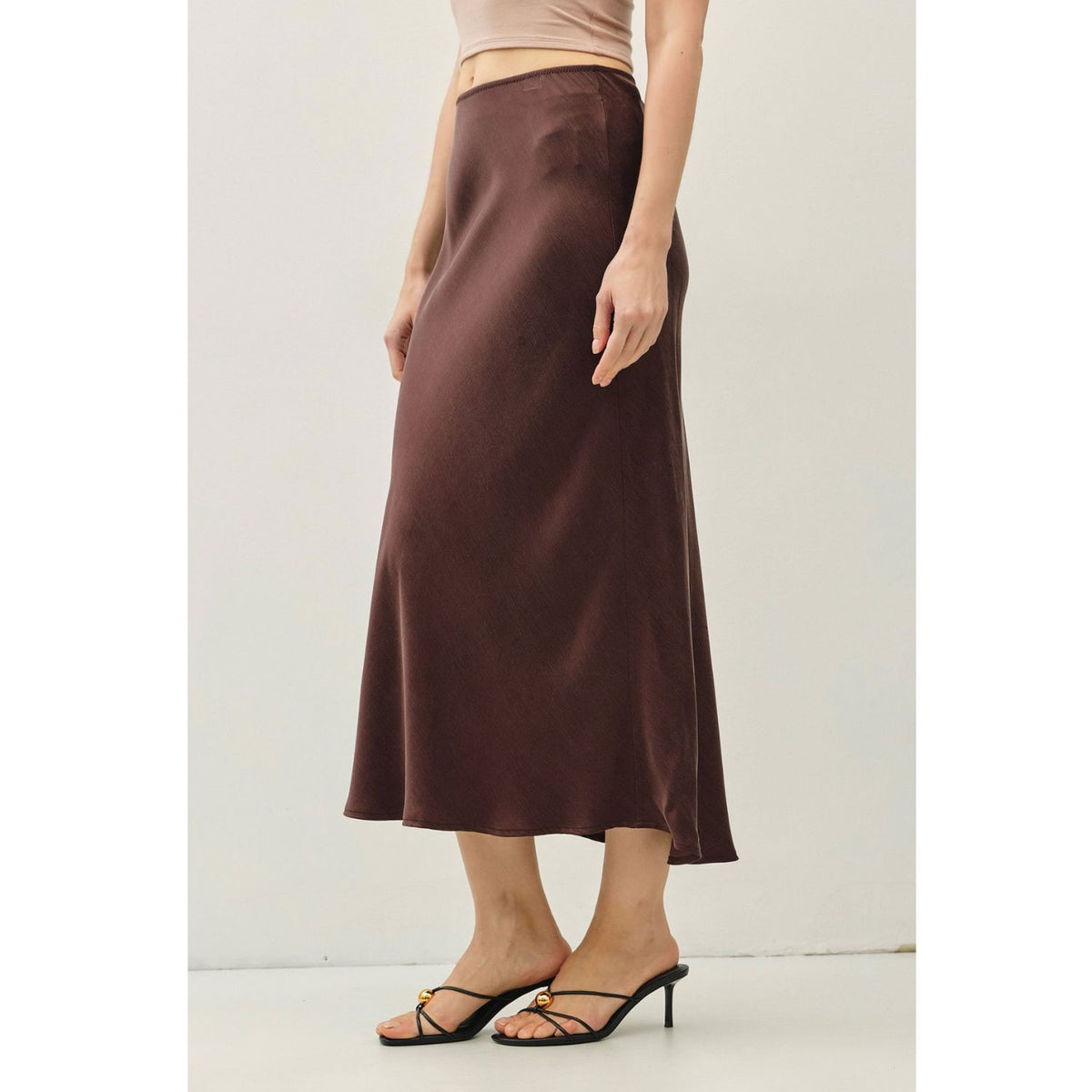 Women's suede-feel midi skirt with a high-rise elastic waistband, pull-on design, and flowing fit-and-flare silhouette