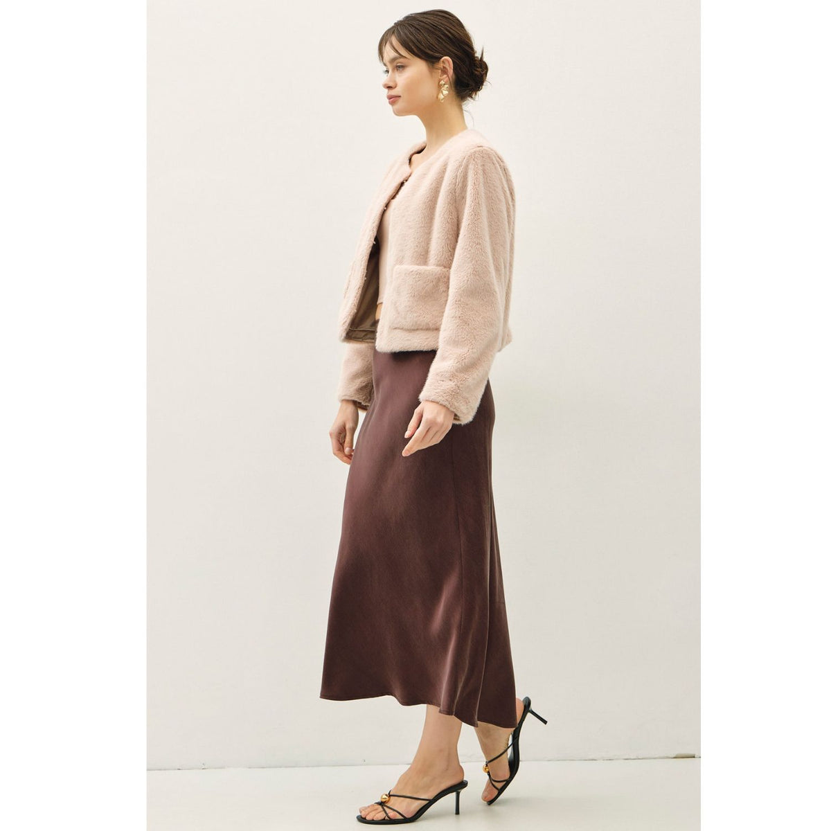 Women's suede-feel midi skirt with a high-rise elastic waistband, pull-on design, and flowing fit-and-flare silhouette