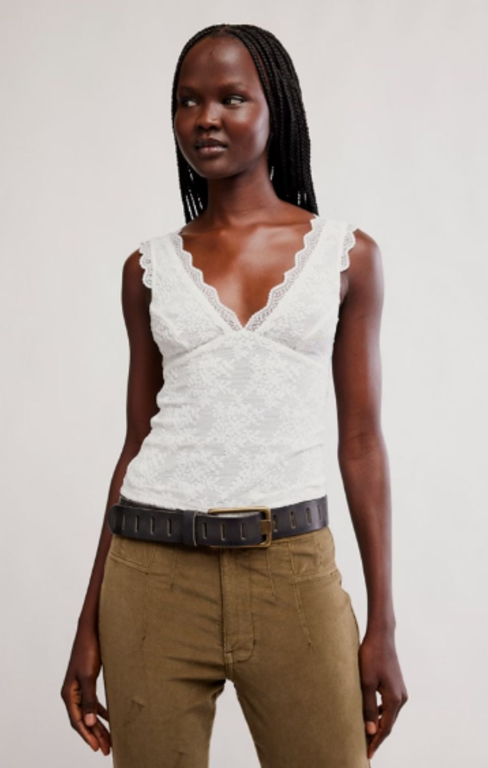 Women's lace tank top featuring a V-neckline, scalloped trim, and feminine open-back detailing