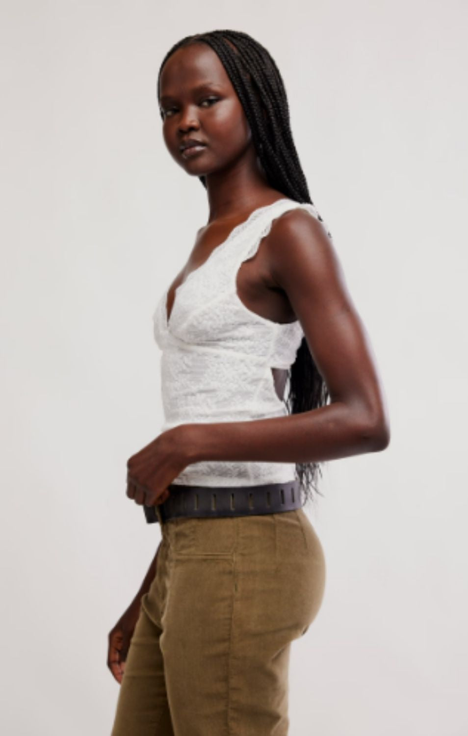 Women's lace tank top featuring a V-neckline, scalloped trim, and feminine open-back detailing