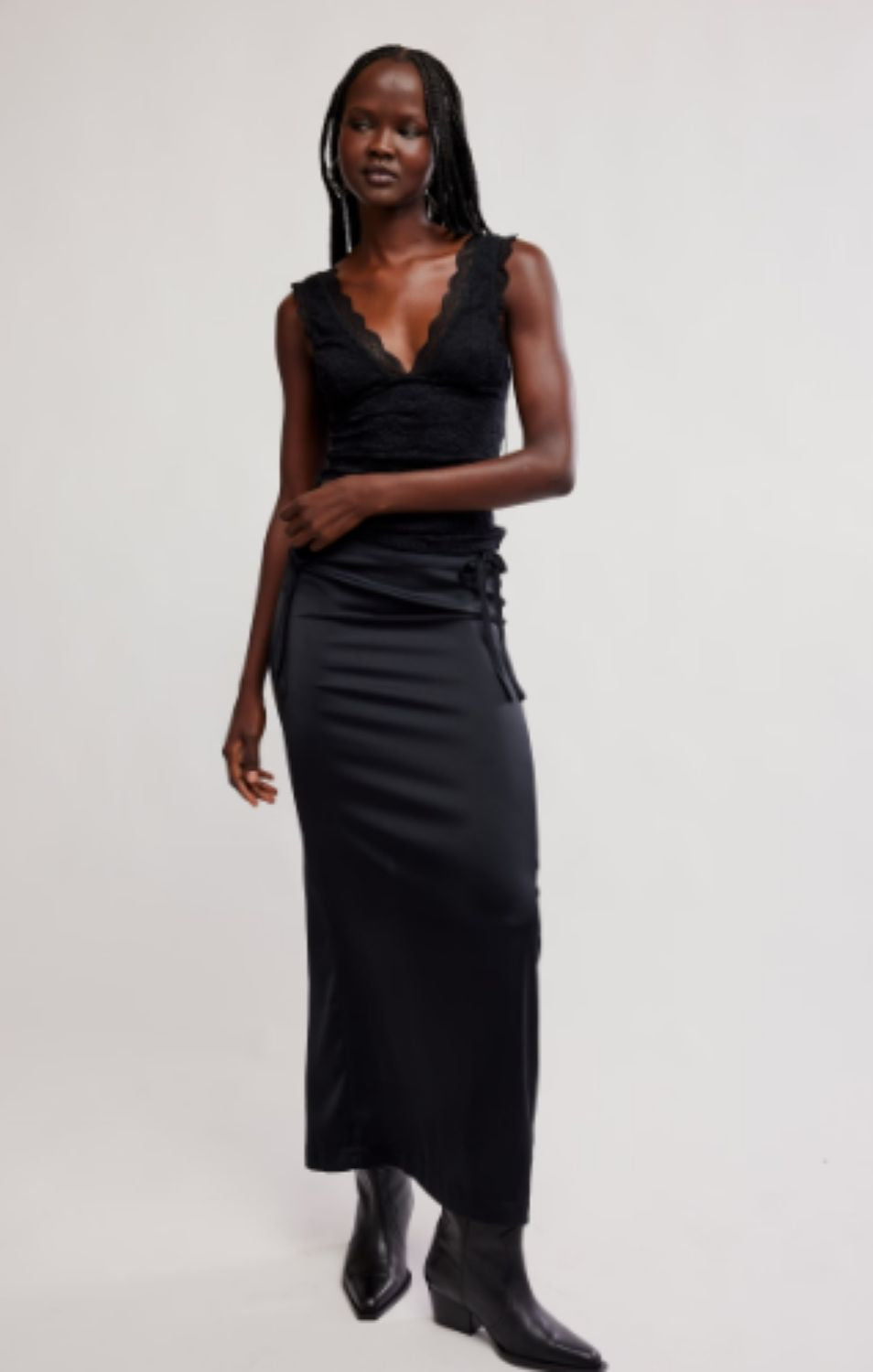 Women's lace tank top featuring a V-neckline, scalloped trim, and feminine open-back detailing