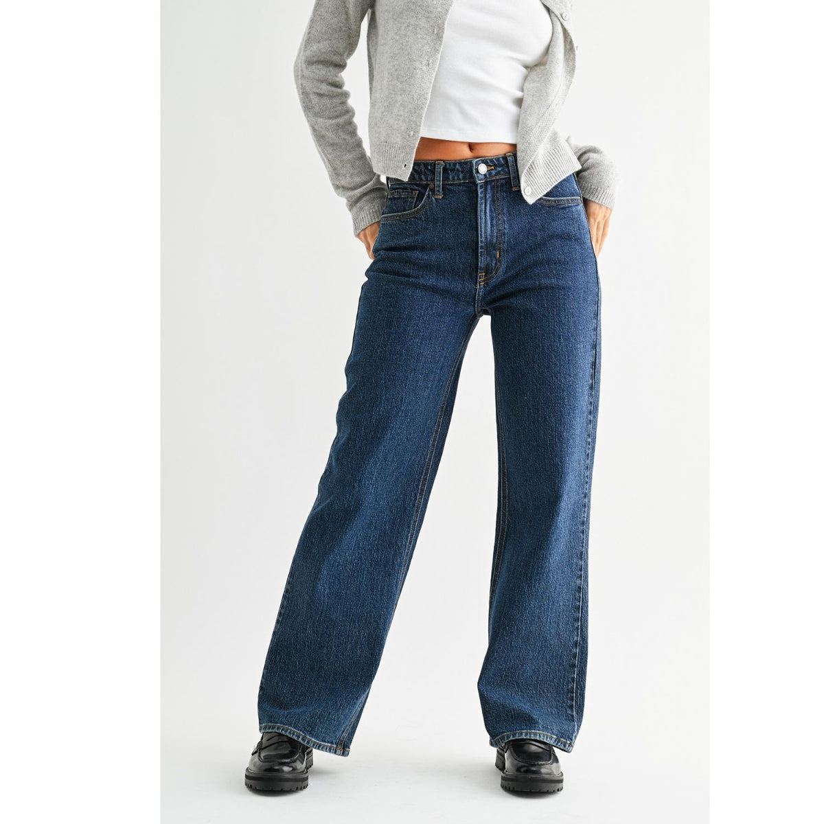 High-Rise Straight-Leg Jeans feature a flattering high-rise waist and full-length straight-leg silhouette. The rich dark denim wash creates a sleek, elongated look with a polished finish.