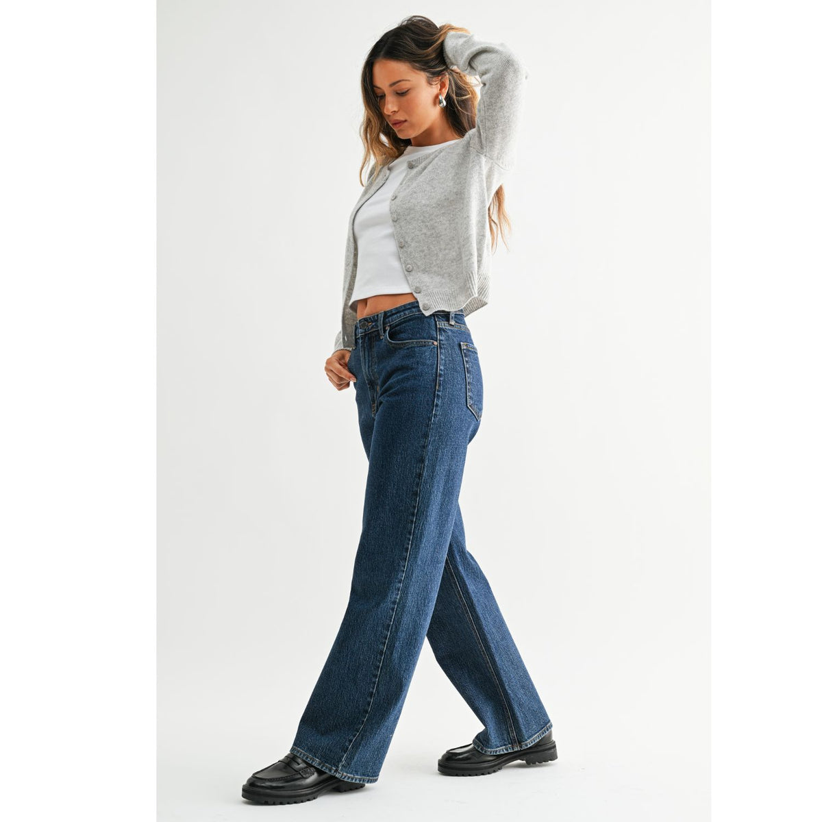 High-Rise Straight-Leg Jeans feature a flattering high-rise waist and full-length straight-leg silhouette. The rich dark denim wash creates a sleek, elongated look with a polished finish.
