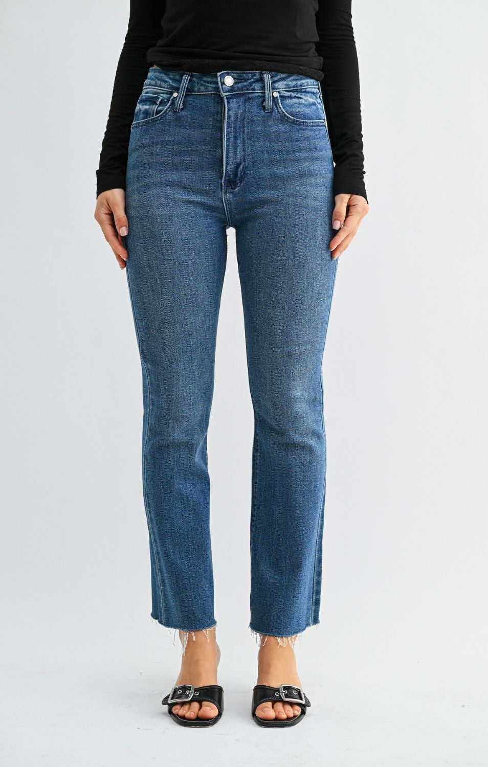 High-Rise Cropped Demi Flare Jeans feature a flattering slim fit through the hips and thighs, with a gently flared leg and cropped length for a modern, stylish silhouette.