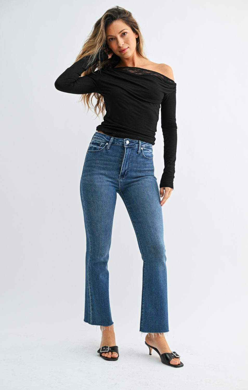 High-Rise Cropped Demi Flare Jeans feature a flattering slim fit through the hips and thighs, with a gently flared leg and cropped length for a modern, stylish silhouette.
