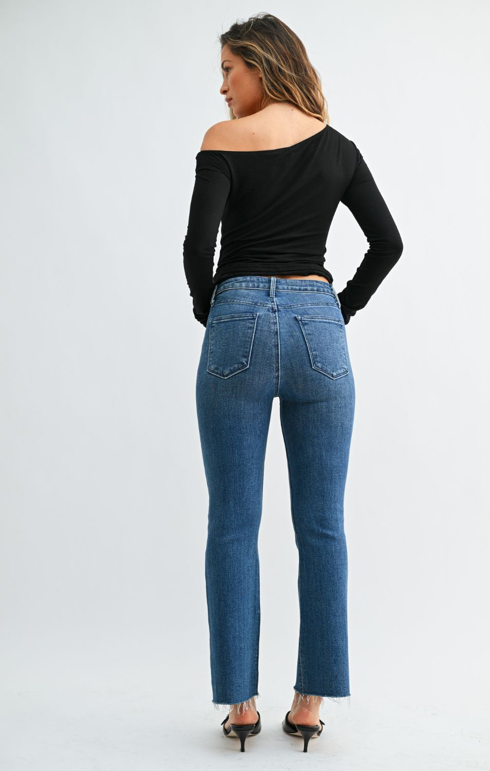 High-Rise Cropped Demi Flare Jeans feature a flattering slim fit through the hips and thighs, with a gently flared leg and cropped length for a modern, stylish silhouette.