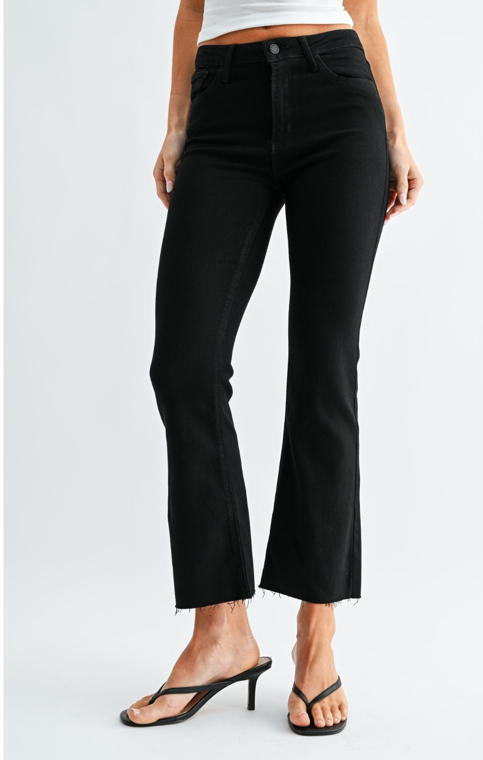 High-Rise Cropped Demi Flare Jeans feature a slim fit through the hips and thighs with a gently flared leg. The cropped silhouette and comfortable stretch offer a flattering, modern denim look