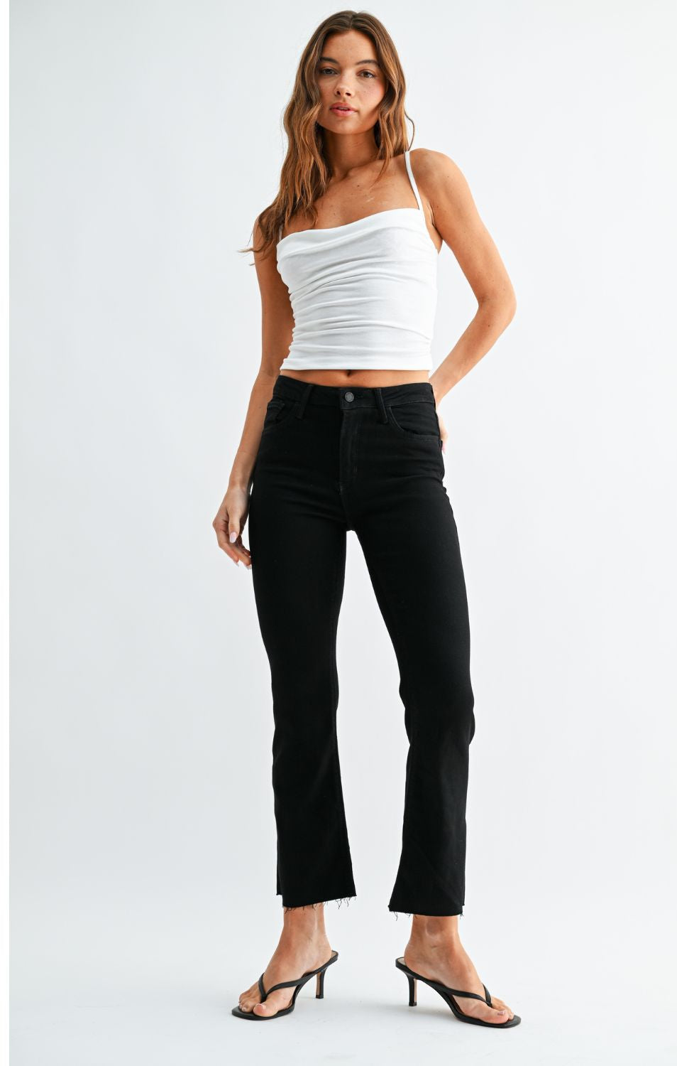 High-Rise Cropped Demi Flare Jeans feature a slim fit through the hips and thighs with a gently flared leg. The cropped silhouette and comfortable stretch offer a flattering, modern denim look