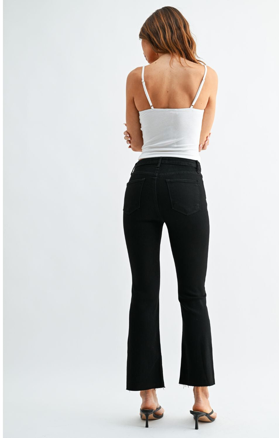 High-Rise Cropped Demi Flare Jeans feature a slim fit through the hips and thighs with a gently flared leg. The cropped silhouette and comfortable stretch offer a flattering, modern denim look