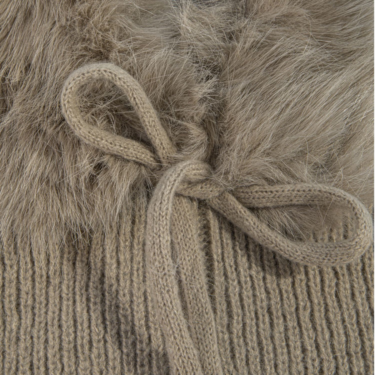 Knit balaclava with plush long-pile trim, ribbed shoulder cape, and tie neckline.