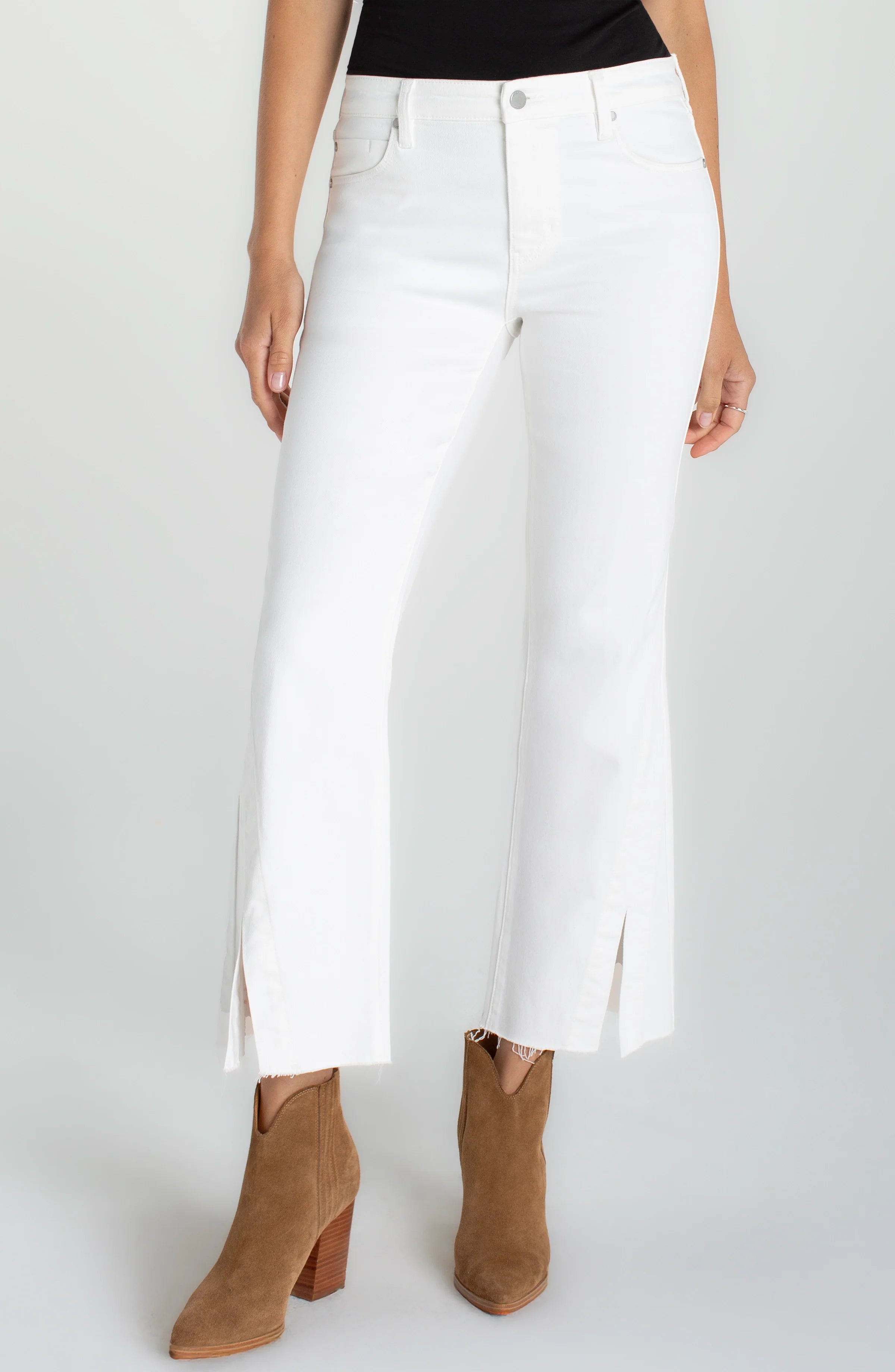 Clean, modern, and effortlessly flattering. This cropped wide leg denim features a sleek high-rise fit with subtle side slits at the hem for a fresh, updated finish. Easy to style and perfect for day-to-night wear.