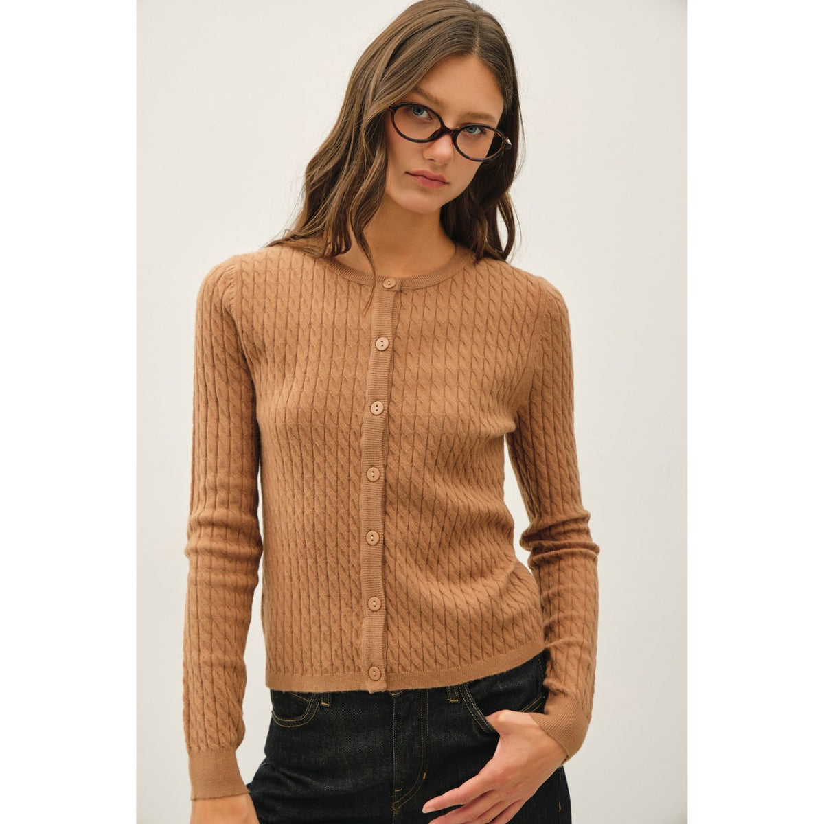 Women's fine cable knit cardigan with a crew neckline, button-up front, long sleeves, and slim-fit silhouette