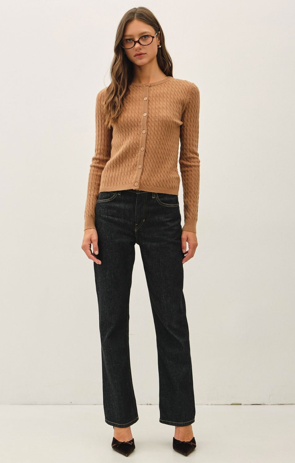 Women's fine cable knit cardigan with a crew neckline, button-up front, long sleeves, and slim-fit silhouette