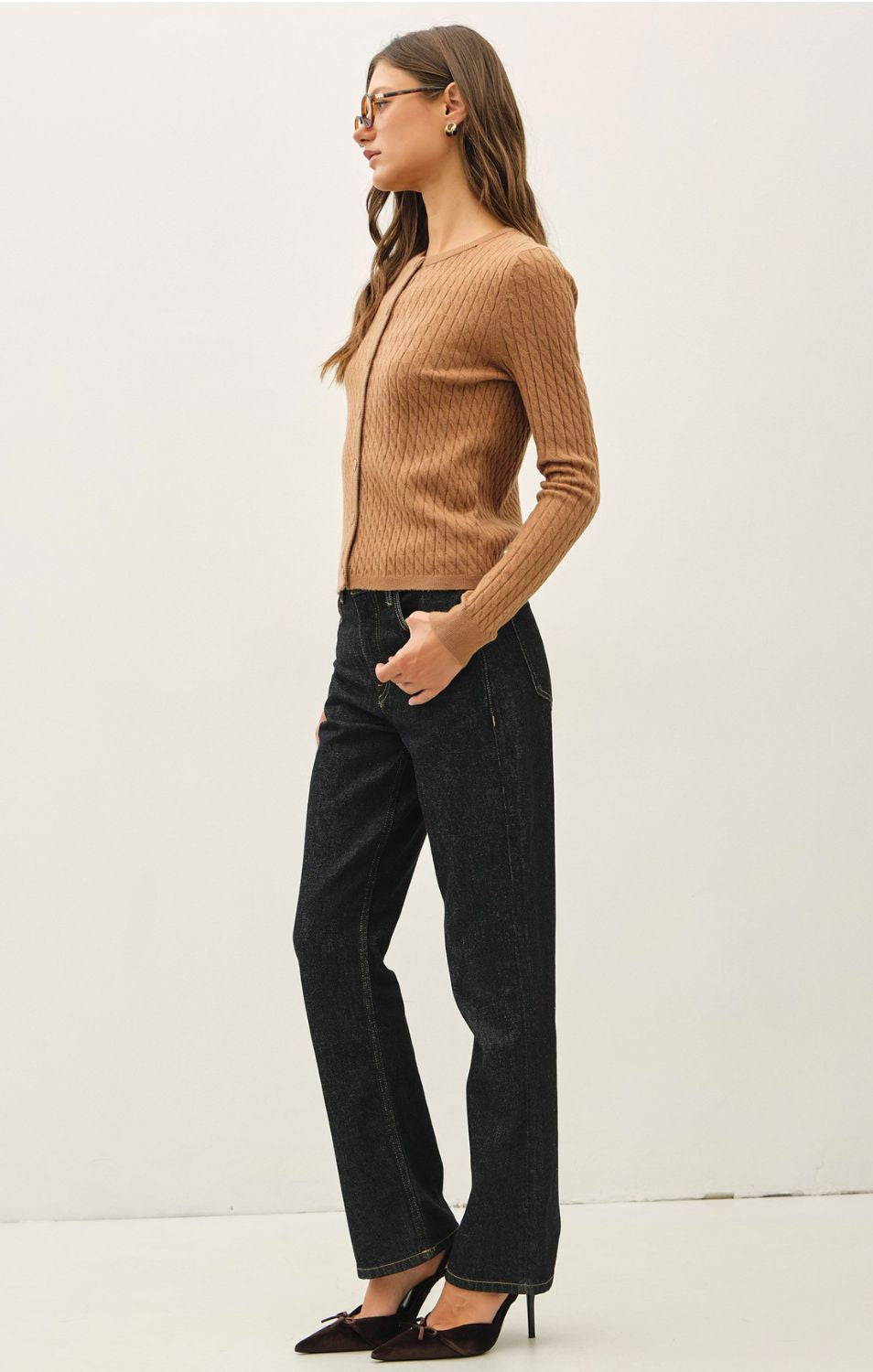 Women's fine cable knit cardigan with a crew neckline, button-up front, long sleeves, and slim-fit silhouette