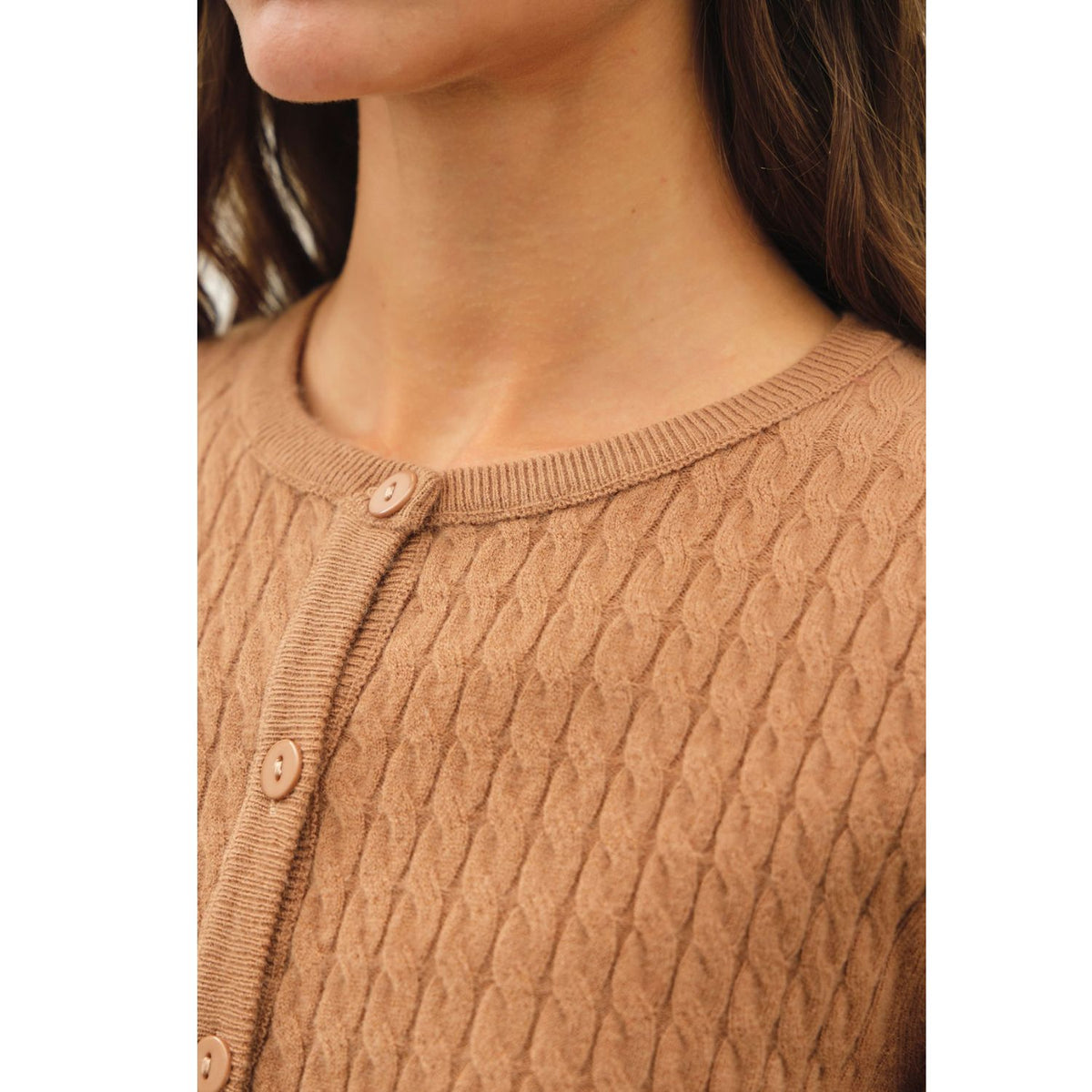 Women's fine cable knit cardigan with a crew neckline, button-up front, long sleeves, and slim-fit silhouette
