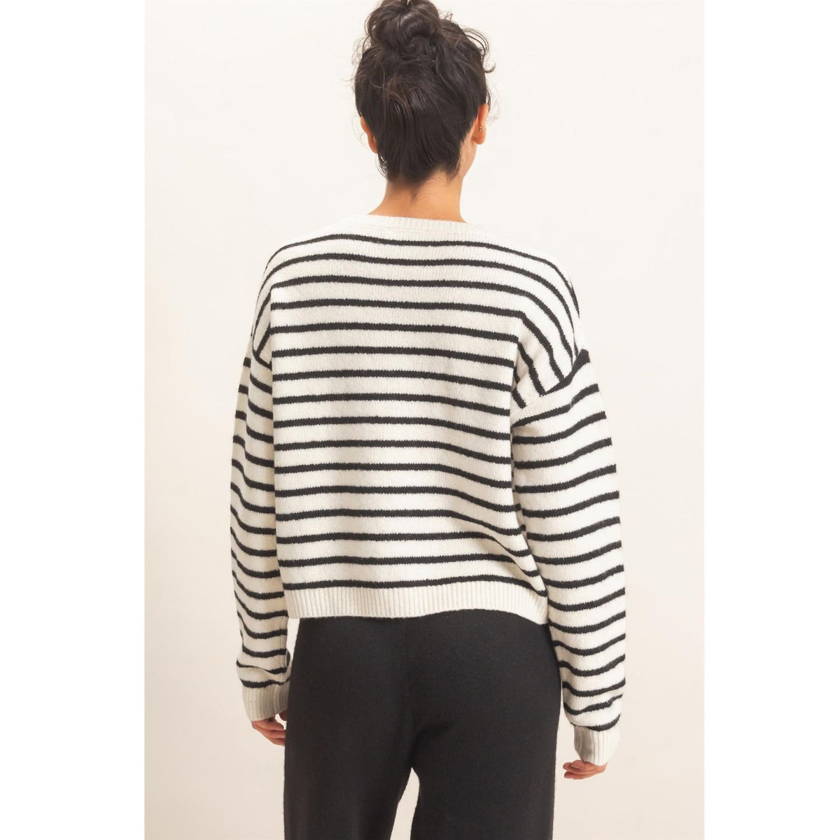 Model wearing Moonbeam Stripe Cozy Crewneck Sweater with black stripes, featuring a relaxed fit and ribbed trims
