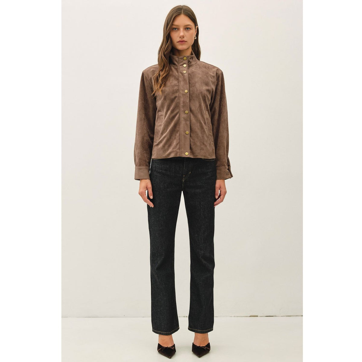 Women's suede-feel bomber jacket with a high collar, zipper and snap-button front, welt pockets, and banded hem