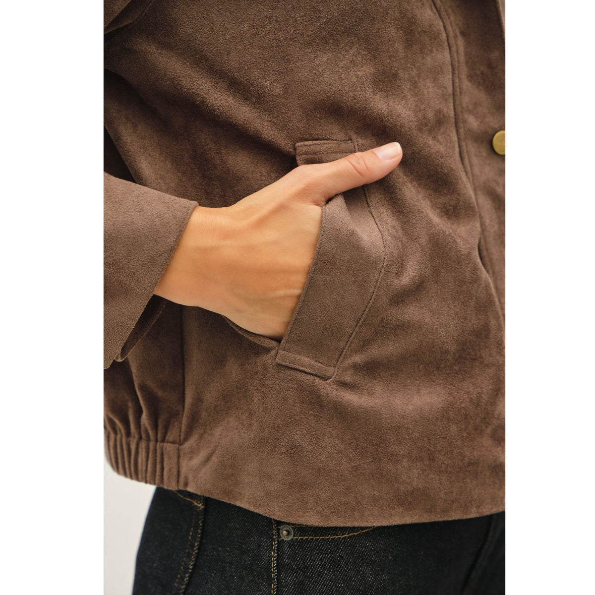 Women's suede-feel bomber jacket with a high collar, zipper and snap-button front, welt pockets, and banded hem