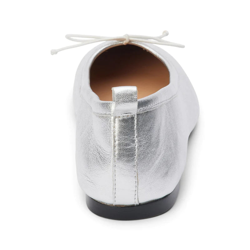 Coconut by Matisse Nikki Ballet Flat Silver. These classic ballet flats feature a soft leather design with a small bow detail and slip on style perfect for all day comfort when you're on the go.