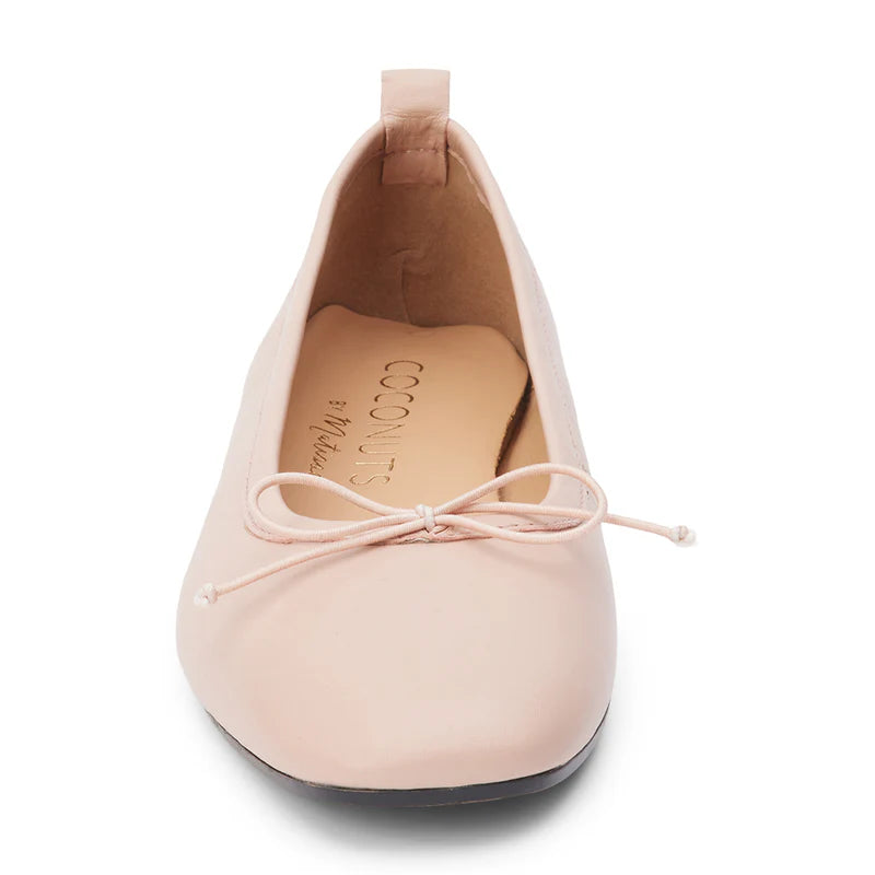 Coconut by Matisse Nikki Ballet Flat Nude. These classic ballet flats feature a soft leather design with a small bow detail and slip on style perfect for all day comfort when you're on the go.