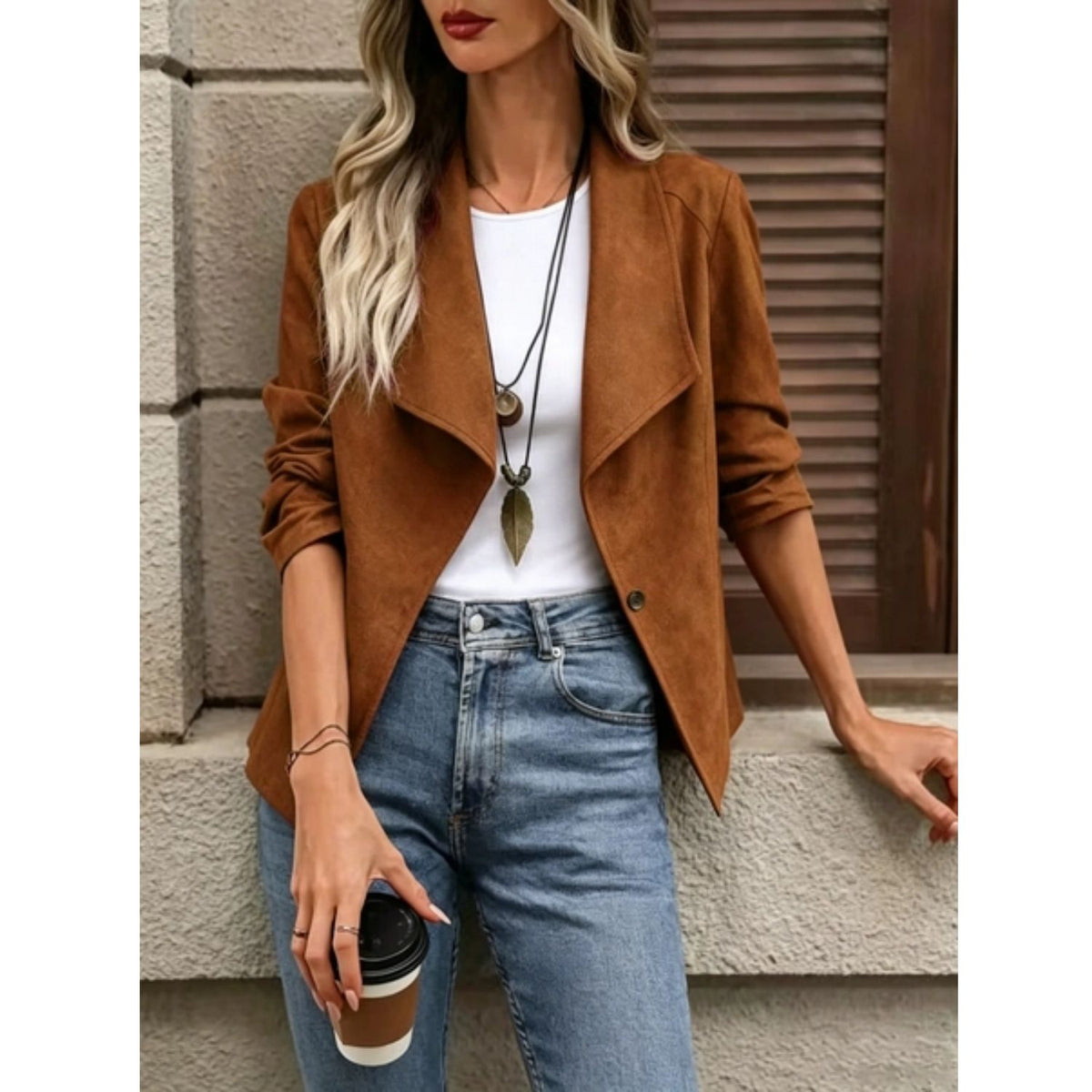 Faux suede jacket with an open front, draped lapel, and long sleeves.