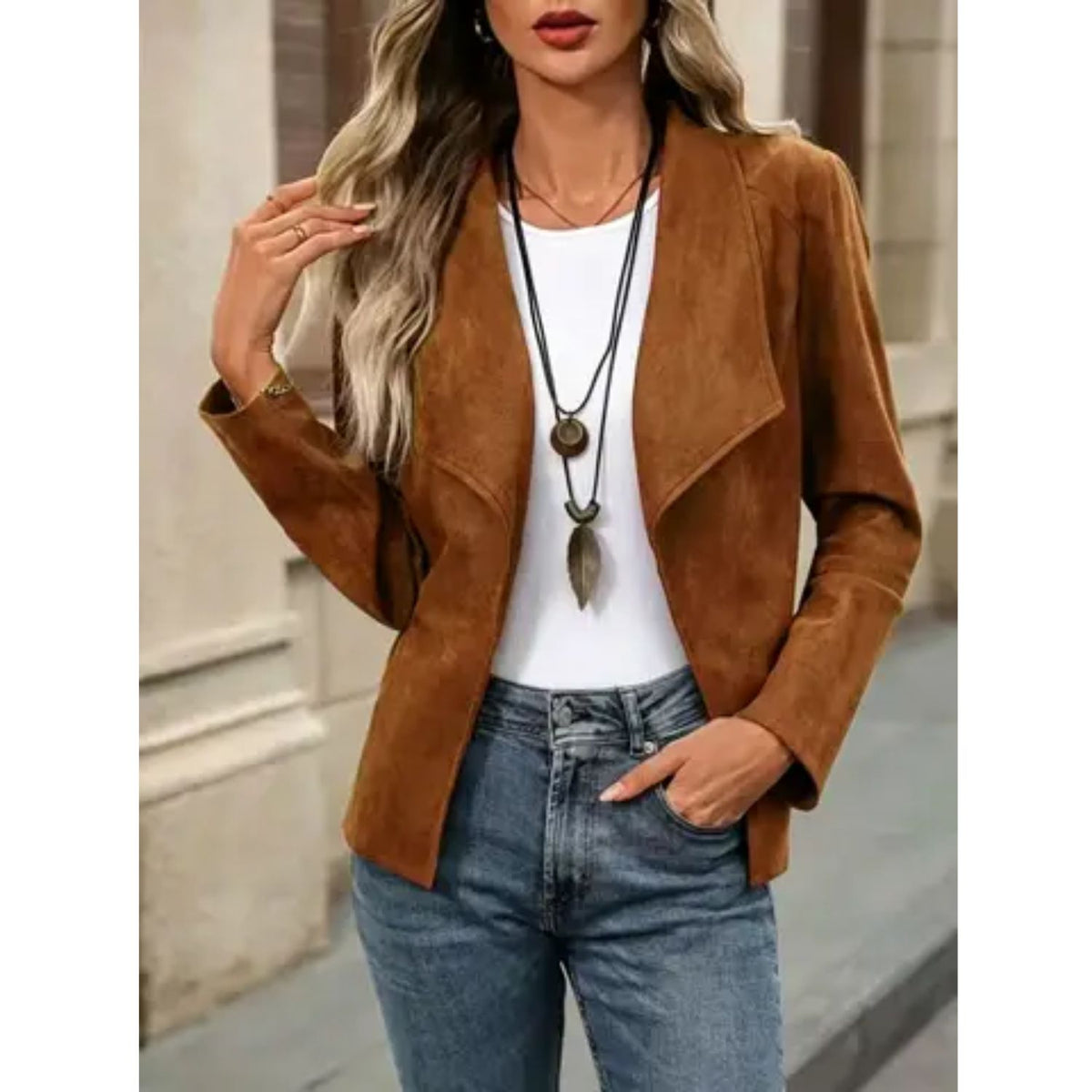 Faux suede jacket with an open front, draped lapel, and long sleeves.