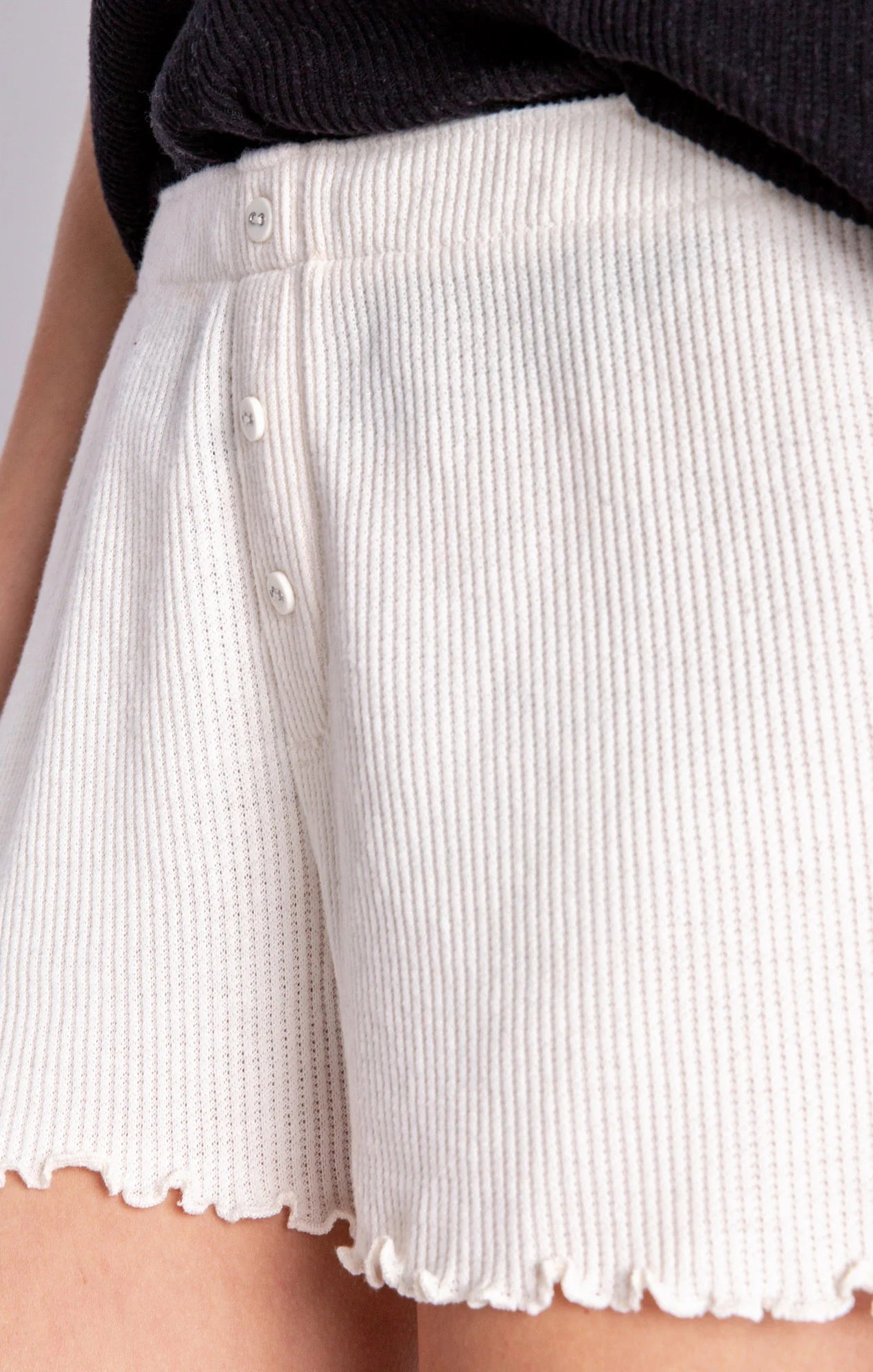 PJ Salvage Textured Essential Short Stone. The essentially perfect lounge short, sure to be a year-round favorite in soft rib peachy jersey, featuring a flirty merrowed edge hem, and tiny faux buttons at fly.