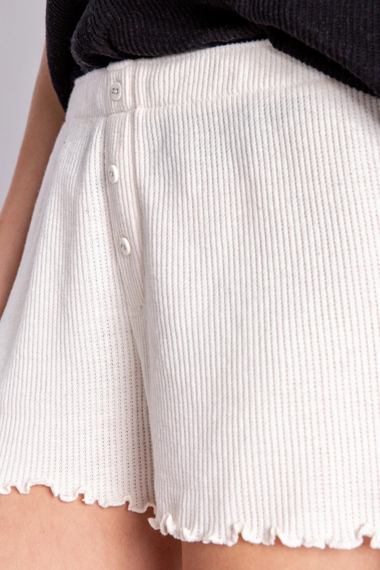 PJ Salvage Textured Essential Short Stone. The essentially perfect lounge short, sure to be a year-round favorite in soft rib peachy jersey, featuring a flirty merrowed edge hem, and tiny faux buttons at fly.