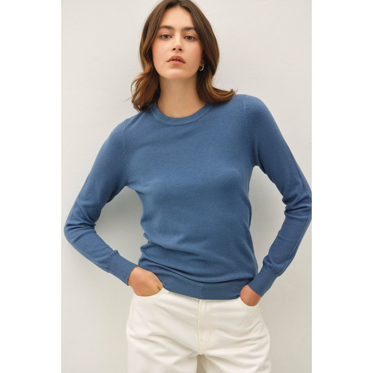 Women's sage crew neck knit sweater with long sleeves, ribbed hem and cuffs, and a relaxed fit