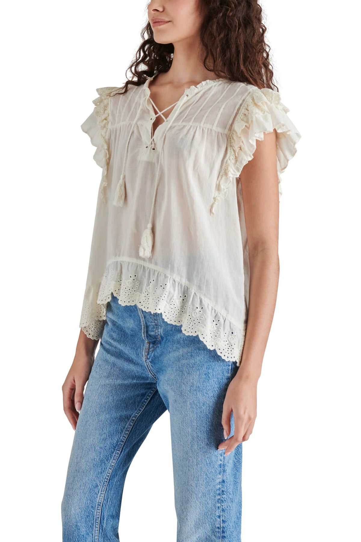Steve Madden Bellamy Top Ivory. Set your boho spirit free in this breezy cotton top designed with eyelet-trimmed ruffles and a tassel-tie neck.