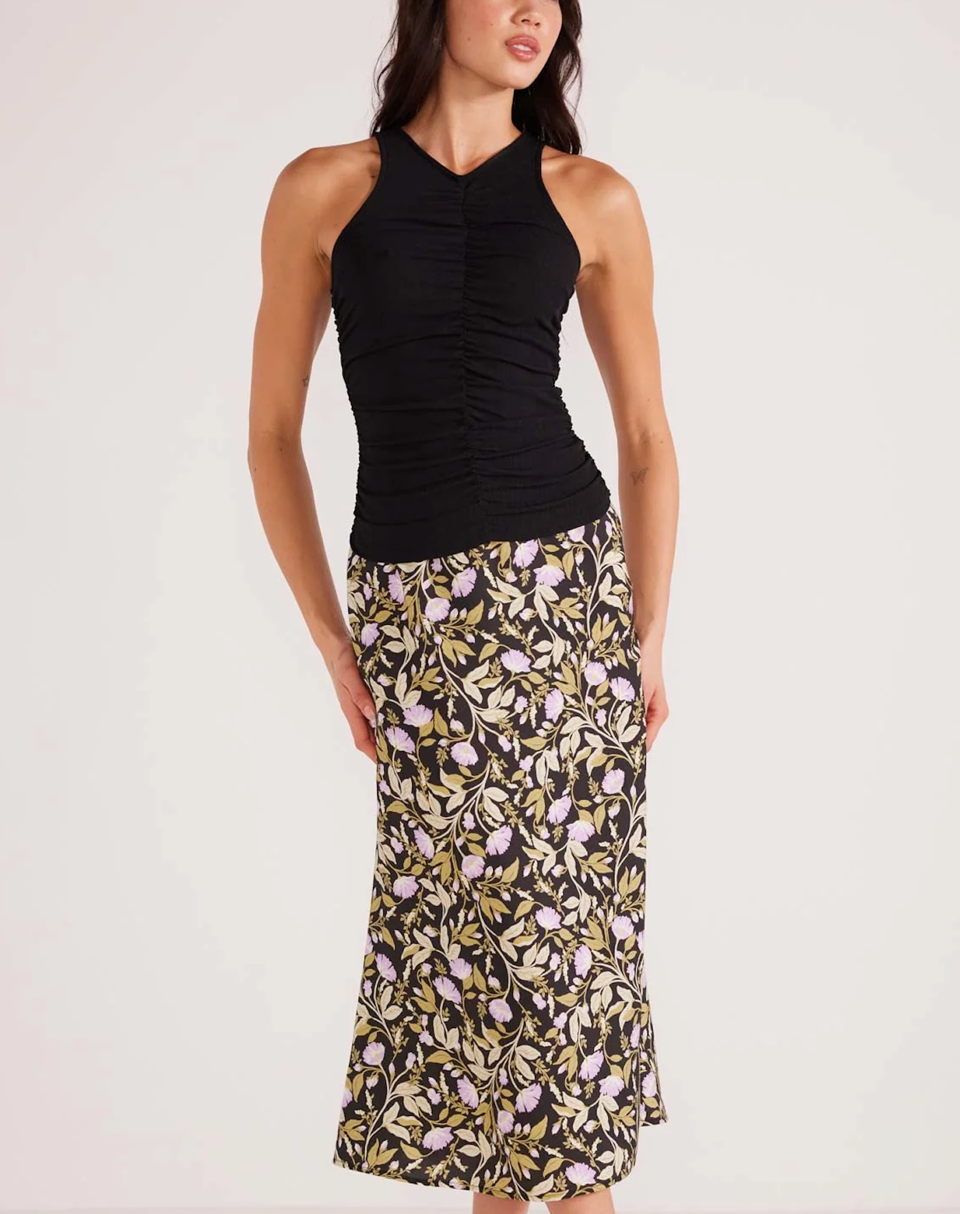 Mink Pink Louis Ruched Tank Black. The Louis Ruched Tank is the perfect styling piece that can either be used as a layer for those cooler months or by itself for when its warmer. Style with a printed bottom for a more elevated look or simple denim for a more 'off-duty' casual look.