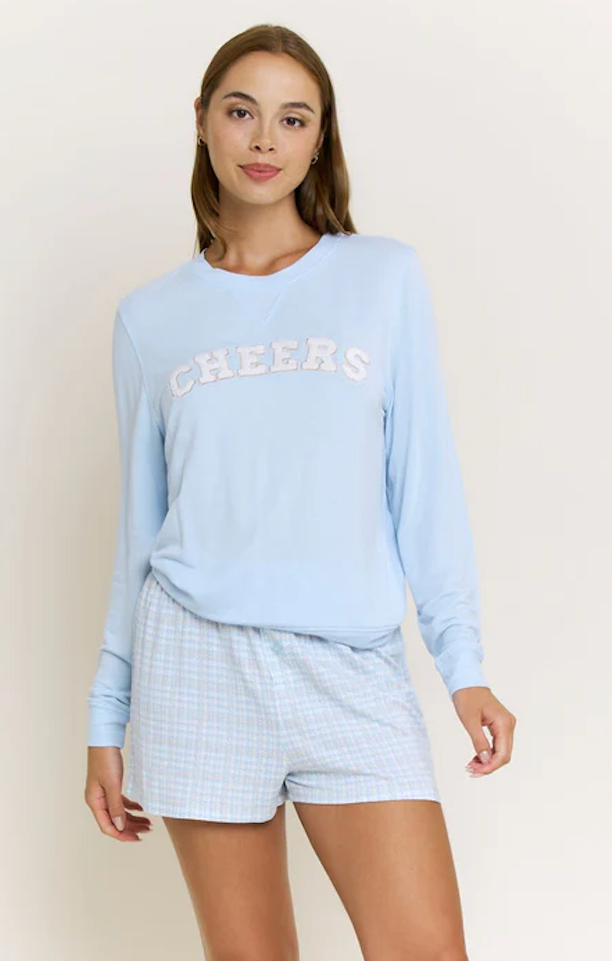 cheers lounge set, light blue pajama set women, women’s cozy lounge set, embroidered cheers top, gingham pajama shorts, cute sleepwear set, soft knit pajama set, women’s casual loungewear, comfy matching lounge set, boutique pajama set, relaxed fit sleep set, women’s lounge outfit, cute bedtime set, chic sleepwear women, cozy at home outfit