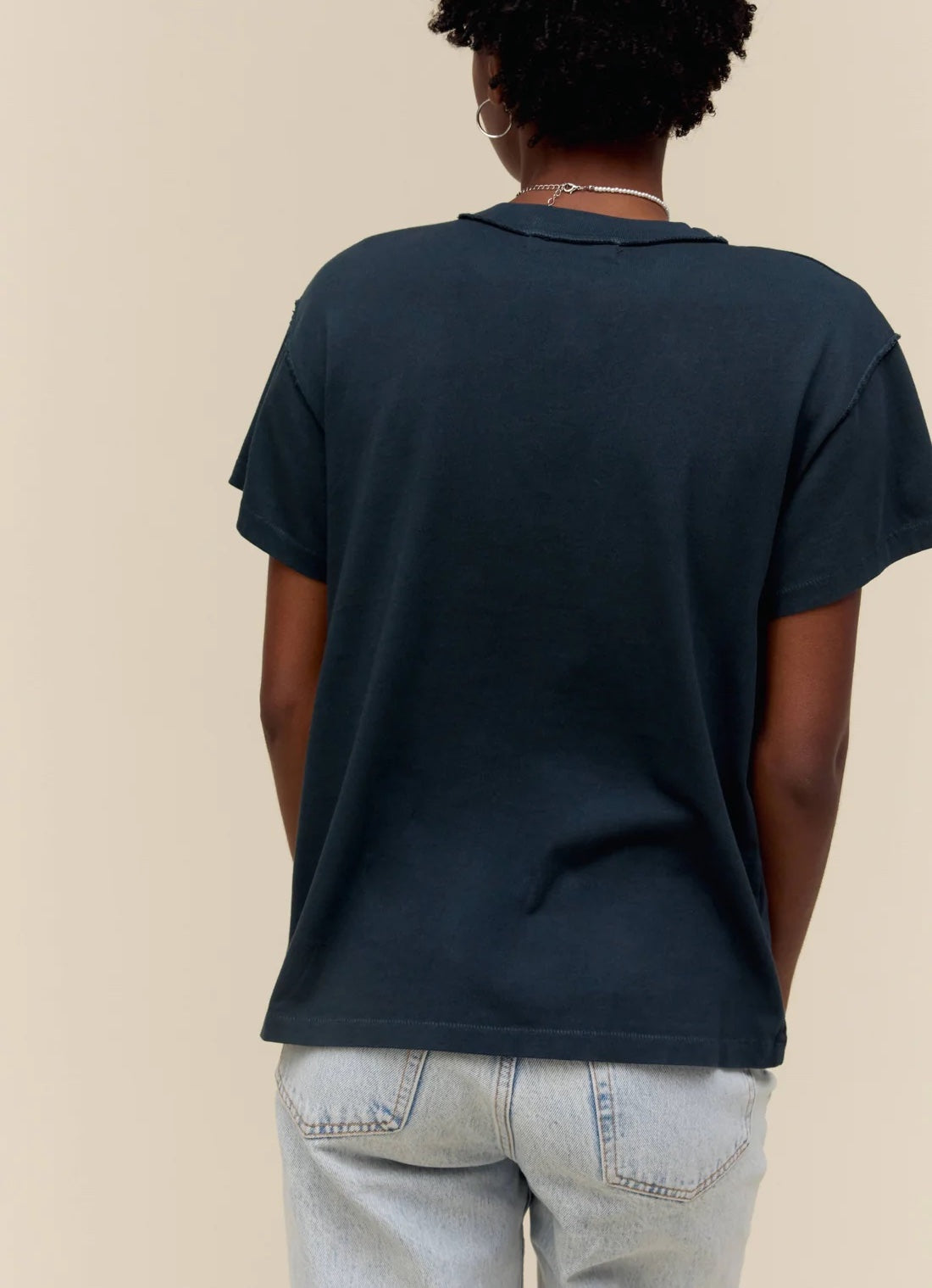 Day Dreamer Shania Twain Tee Vintage Black. The master example of women empowerment lands on a reverse tour tee, bound to stir up some commotion. Featuring a photo of the icon back in her peak.
