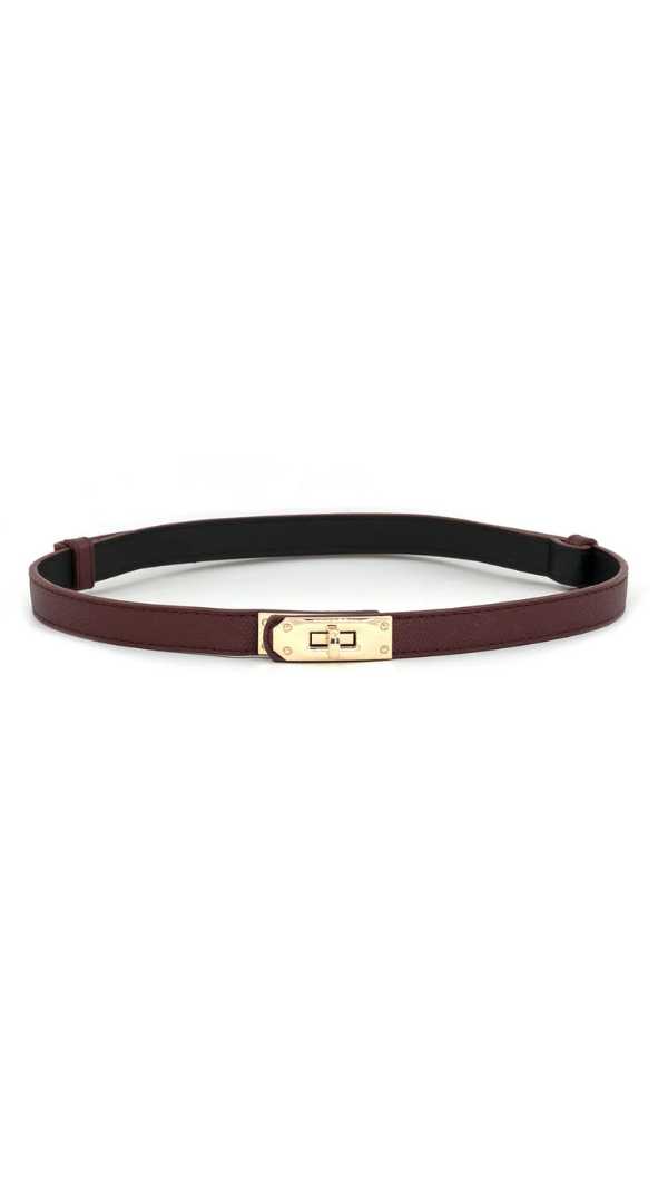 A slim burgundy leather belt with a polished gold-tone metal clasp, displayed horizontally on a clean white background.