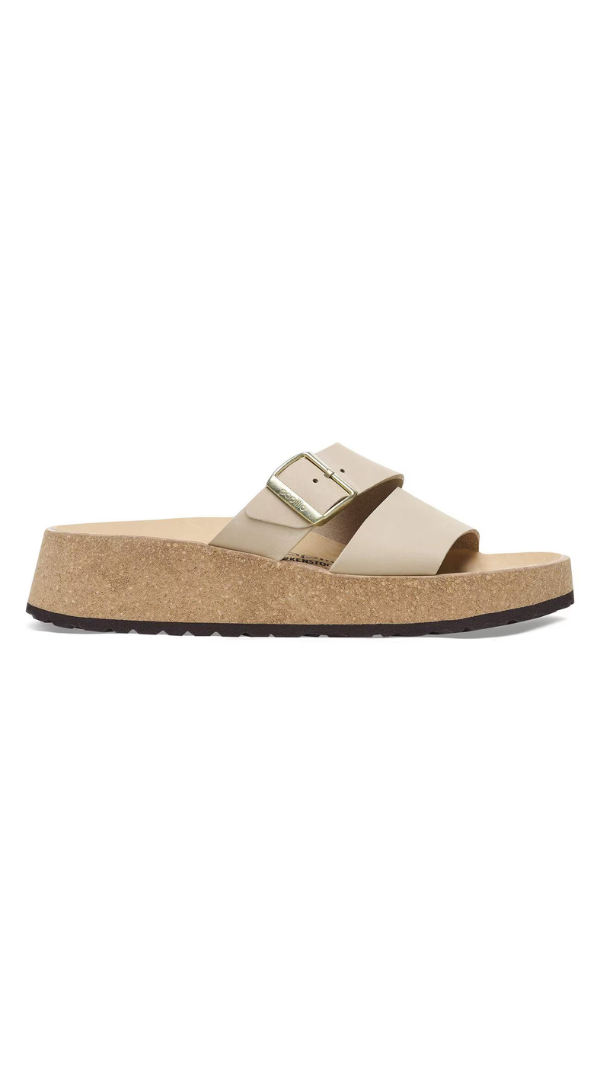 Platform slide sandal with a contoured cork footbed and adjustable buckle strap detail