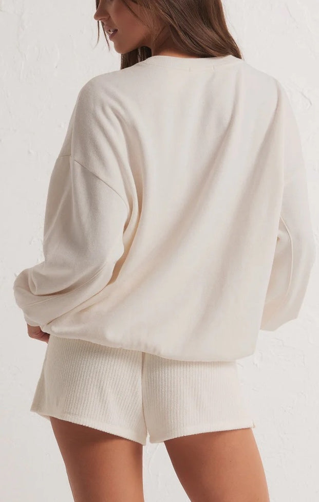 Z Supply Oversized Vacay Sweatshirt White. Planning a vacay? Grab the Oversized Vacay Sweatshirt and stay comfy on your flight or road trip. This classic crew pullover is also perfect for staycations or lounging around the house. Throw it on over denim and this top easily creates a comfy casual look.