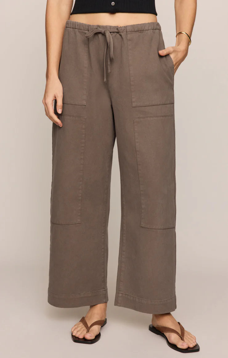Relaxed wide-leg utility pants with an elastic drawstring waistband, oversized patch pockets, and a comfortable everyday fit.